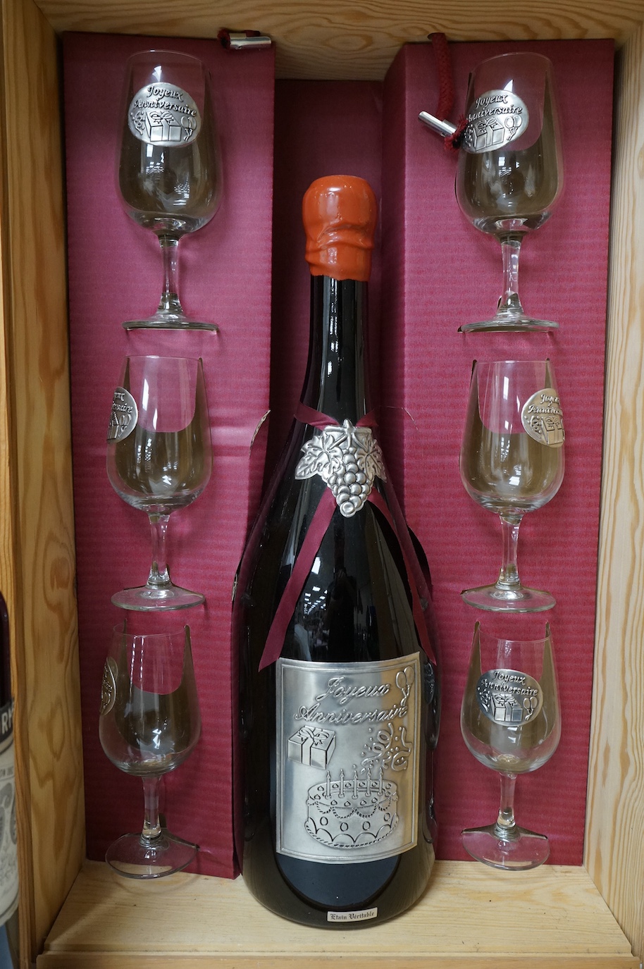 One bottle of Kummel, another, Tokaji, and a Joyeux Anniversaire, cased